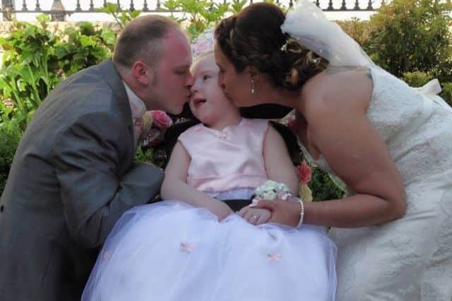 Cora Mc-Quade Denvir as flower girl at the wedding of her parents Amy and Ciaran last July. INLT-10-700-con