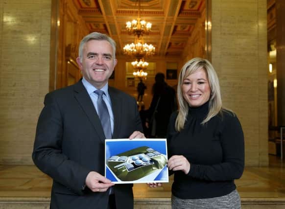 Ministers Jonathan Bell and Michelle ONeill with an image of the plant