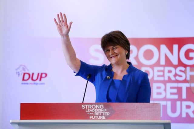 Arlene Foster waves to the party faithful