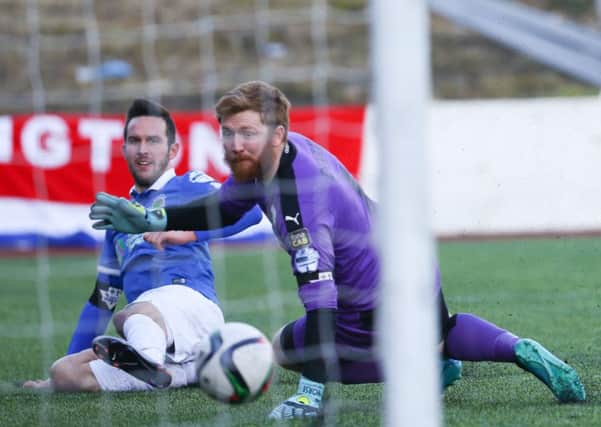 Andy Waterworth scores past Cliftonville's Conor Devlin