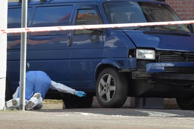 Forensic officers at the scene of the bombing