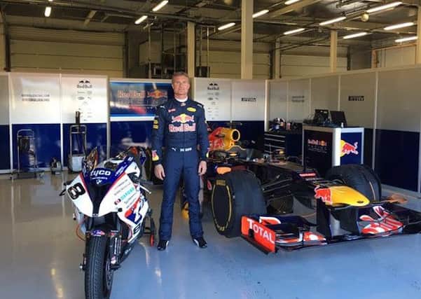David Coulthard with Guy Martin's Tyco BMW and the V8 Red Bull racing car.