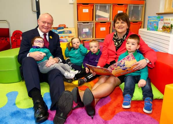 First Minister Arlene Foster and Deputy First Minister Martin McGuinness with (left to right) Sophia Magee, Paige Foster, Logan McClean and Carter Wilton in their brand new play room in the Mencap Centre