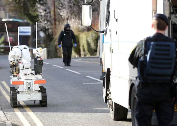 Security alert in the Upper Dunmurry Lane area of west Belfast following the discovery of a suspicious object