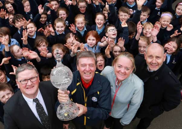 The children of Straffan National School joined (l-r) Tom Walsh of Waterford Crystal, Dubai Duty Free Golf Ambassador Des Smyth, Antonia Beggs from The European Tour and Brian McIlroy of the Rory Foundation to launch the Dubai Duty Free Irish Open Trophy Tour.