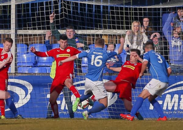 Dungannon Swifts' Andrew Mitchell scores against Cliftonville