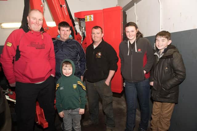 Alister Grier, John, Diver, Gavan Gallagher, Catherine Grier,  Adam Grier and Andrew Grier at the Donegal Farm Machinery open evening Letterkenny on Thursday. 
 Picture: Clive Wasson