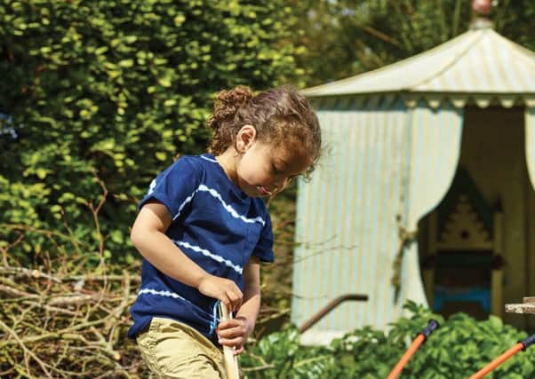 A child helping with the gardening