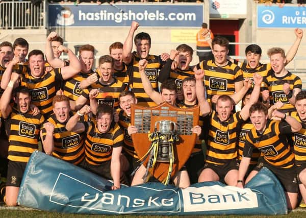 RBAI captain Conor Field celebrates along with his team mates after winning the Danske Bank schools cup 2016.