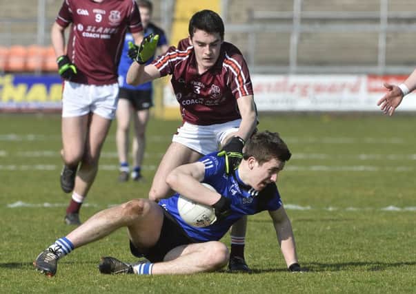 St Patrick's Shane McGuigan in action with St Paul's Declan Loye