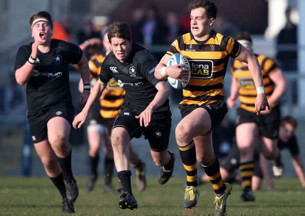 RBAI  James Hume races away to score the only try of the Schools' Cup final