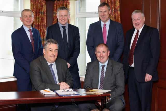 David O'Connor, NIGTA President (seated left) with outgoing President Alan Johnston at the NIGTA AGM. Also included are back from left: Robin Irvine, Chief Executive; Patrick McLaughlin, Honorary Secretary; Keith Agnew and Stephen Burrell.