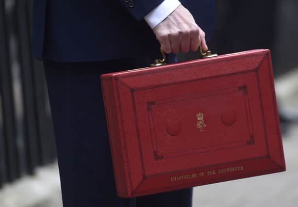 Chancellor of the Exchequer George Osborne holding his red Ministerial box outside 11 Downing Street, London, before heading to the House of Commons to deliver his Budget. PRESS ASSOCIATION Photo. Picture date: Wednesday March 16, 2016. See PA story BUDGET Main. Photo credit should read: Hannah McKay/PA Wire