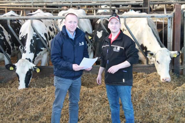 Brian Mc Carron, left, Genus ABS, discusses with Robert Martin, the improved milk quality and production from feeding  better quality forage.