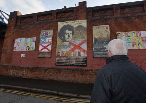Painter and sculptor Ross Wilson at the unveiling of a mural of St Patrick on the Tates Ave bridge in a loyalist area of south Belfast.
Pic Colm Lenaghan/Pacemaker