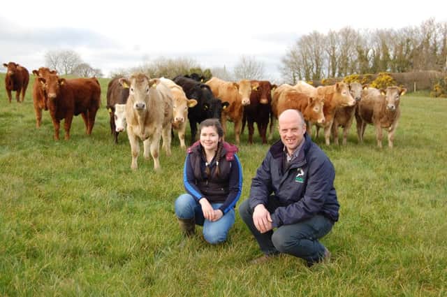 Paul Elwood, from HVS Animal Health, is pictured out on farm with Orla Kelly, a second year CAFRE agricultural degree student.
