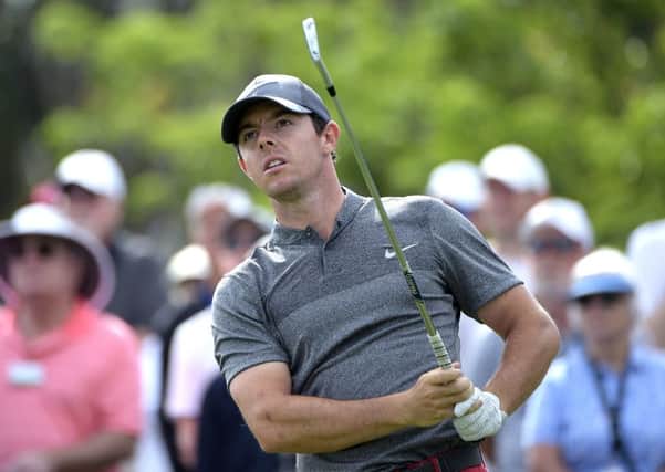 Rory McIlroy watches his tee shot on the seventh hole during the final round of the Arnold Palmer Invitational