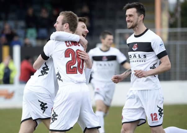 Crusaders maintained their title drive with a 4-0 win against Carrick Rangers on Saturday