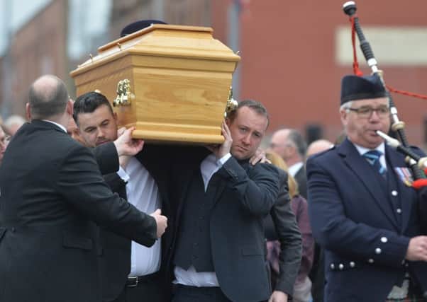 The funeral cortege for murdered prison officer Adrian Ismay arrives at Woodvale Methodist Church