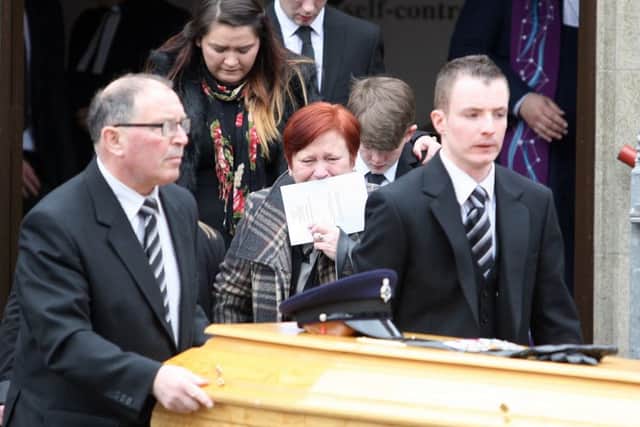 The funeral for prison officer Adrian Ismay.
Pictured behind the coffin is his wife 
Sharon Ismay