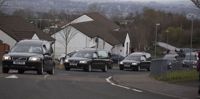 The cortege of hearses bringing the victims home