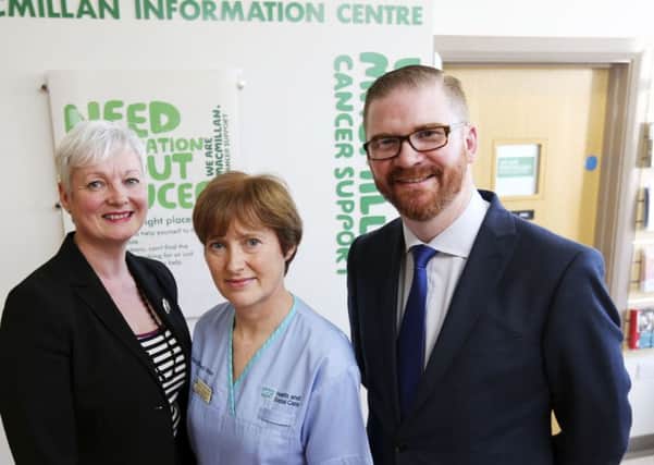 Health Minister Simon Hamilton, Head of Macmillan Services in Northern Ireland Heather Monteverde and Macmillan Breast Care Nurse Specialist Rosey Whittle, during a visit to the Breast and Endocrine Centre at the Ulster Hospital.