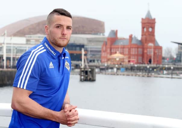 QPR striker Conor Washington pictured in Cardiff Bay in front of the Welsh Assembly building after getting his first international call up