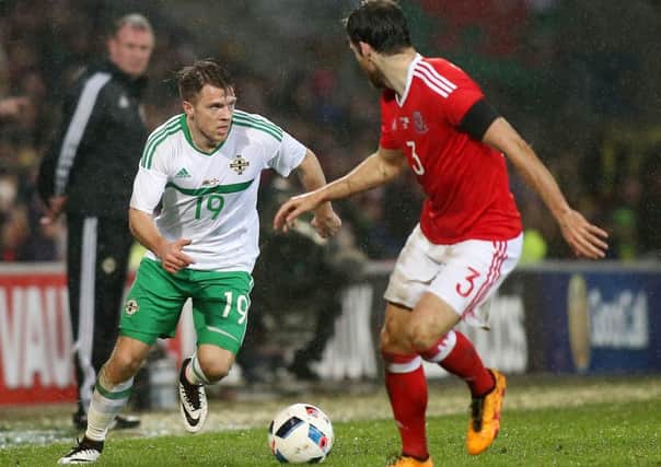 Wales' Adan Matthews with Northern Ireland's Jamie Ward