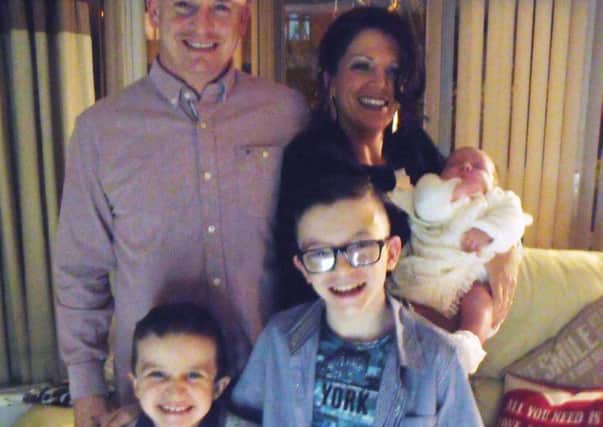 Undated family handout photo issued by the Garda of Sean McGrotty, with his partner Louise holding their baby, four-month-old Rionaghac-Ann and his sons Mark, 12, (right) and Evan, eight