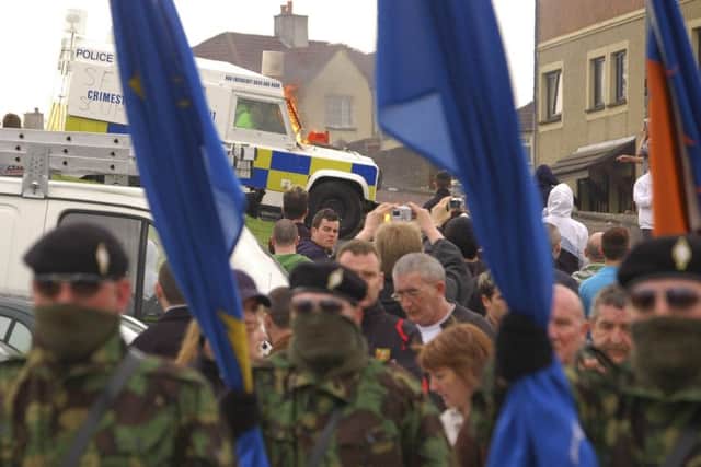 A colour party from the dissident Real IRA marching to republican plot in Londonderry's city cemetery during a commemoration of the 1916 Easter Rising.