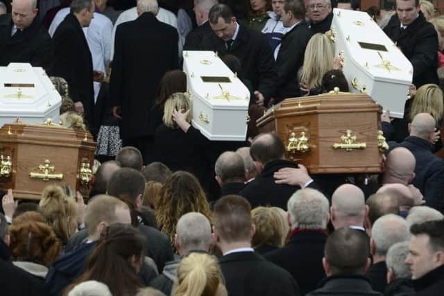 The funeral of five pier victims takes place at Holy Family Church, Ballymagroarty on Thursday