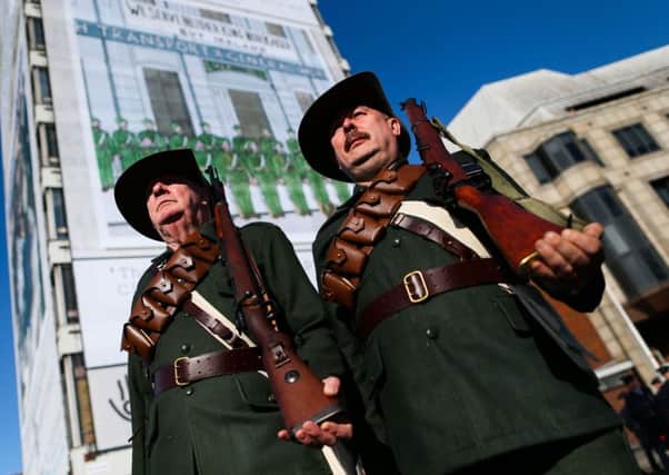 Men dressed as members of the Irish Citizen Army, during the state ceremony at Liberty Hall in Dublin