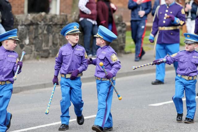 Two young bandsmen enjoy a chat during the parade in Carrickfergus