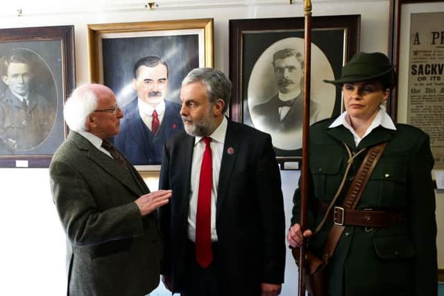 President Micheal D Higgins (left) talks to the Services, Industrial, Professional and Technical Union (SIPTU) chief Jack O'Connor during the state ceremony at Liberty Hall