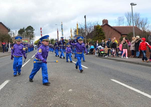 A scene from the Junior Orange Association of Ireland annual Easter Tuesday demonstration in Carrickfergus Northern Ireland before two bands - including the South Belfast Young Conquerors - headed to Belfast's Ormeau Road for a closing parade.