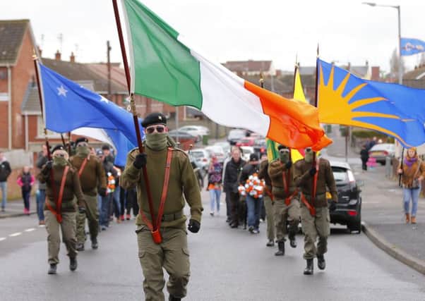 Could some of these masked demonstrators in Lurgan have been prisoners? Pictured is a parade in the Kilwilkie area, March 26, 2016