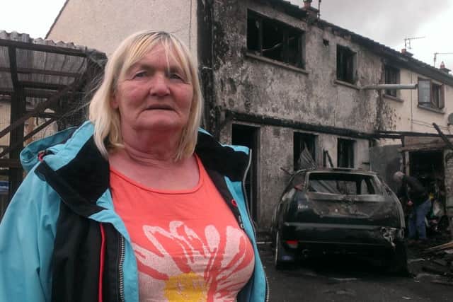 Barbara Williamson outside her burnt out home in Richhill