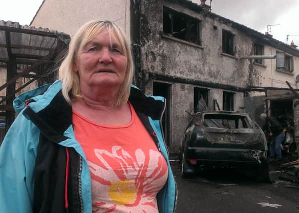 Barbara Williamson outside her burnt out home in Richhill
