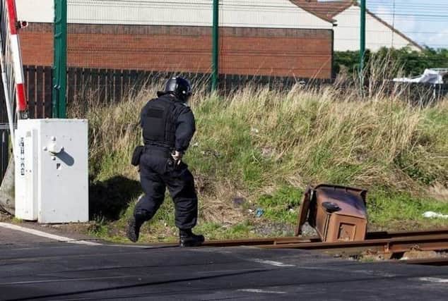 Police recovers burnt out bin from railway tracks in Lurgan