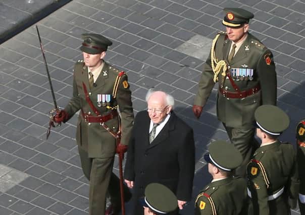 President Michael D Higgins inspects the Guard of Honour at the GPO, prior to the military parade as part of the 1916 Easter Rising centenary commemorations in Dublin