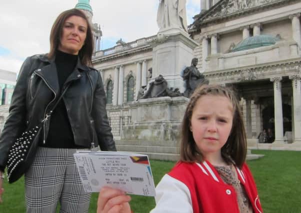 Julie Beattie and daughter Lily, in her Little Mix jacket, outside Belfast City Hall with their tickets