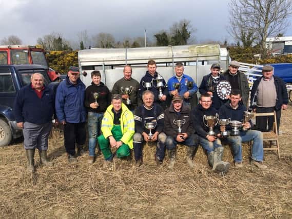 Winston Gill (right) who hosted the Listooder ploughing match on Easter Tuesday pictured with prize winners, judges and Committee members.