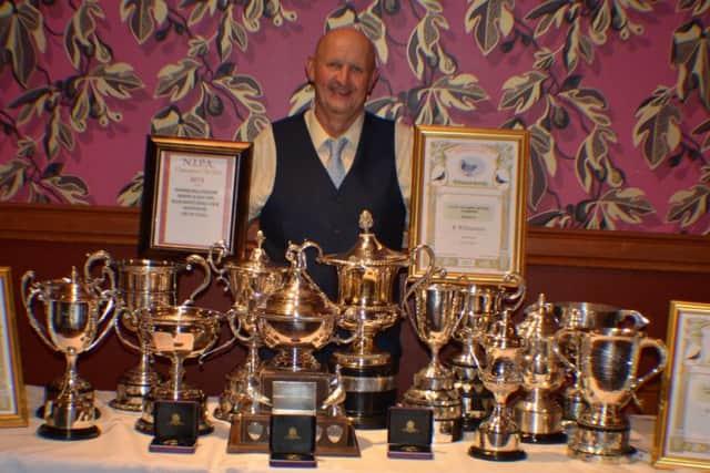 The Master Ronnie Williamson proudly displaying his vast array of awards won at the NIPA Ladies Night 2015