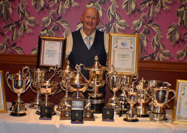 The Master Ronnie Williamson proudly displaying his vast array of awards won at the NIPA Ladies Night 2015