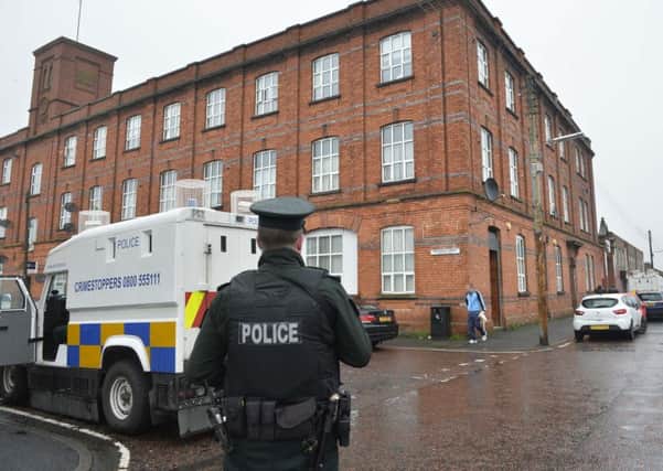 A murder investigation is under way after a woman's body was found in a flat in County Armagh