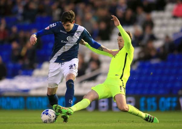 Brighton and Hove Albion's Dale Stephens (right) and Birmingham City's Kyle Lafferty battle for the ball during the Sky Bet Championship match at St Andrews, Birmingham