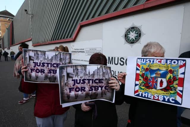 Protesters gather at Musgrave police station in Belfast city centre