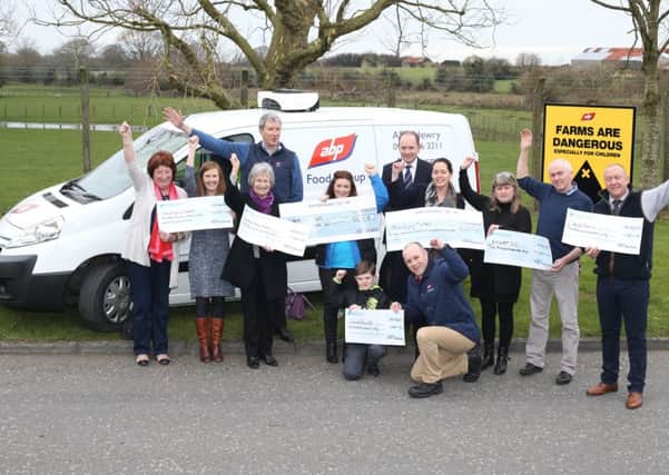 Pictured at the cheque handover to mark ABP, which has sites in Newry and Lurgan, raising more than Â£67,000 for local charities, are (back row l-r) Seamus Kenny from ABP and Roger Sheahan from ABP with (middle row l-r) Sheila King and Siobhan Murphy from Head Injury Support Newry, Eileen Wright from Southern Area Hospice, Lisa Mallon from Alzheimer's Society, Fiona McCabe from Brain Injury Matters, Pattie and Paul McElroy from SMART NI and Elwyn Pugh from ABP and  (front row l-r) Finbar Mallon from Alzheimer's Society with Philip Simpson from ABP.