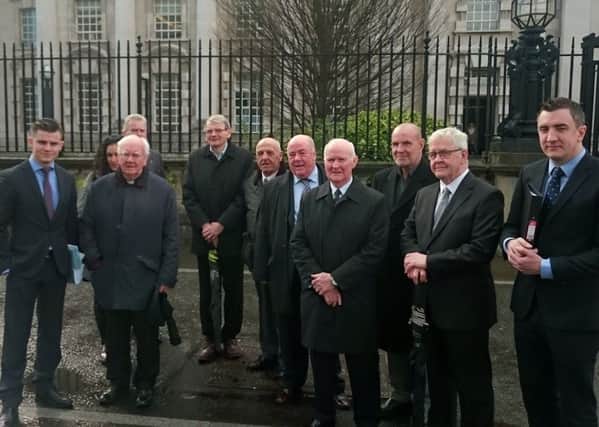Some of the so-called Hooded Men with their solicitor Darragh Mackin (left) outside the High Court in Belfast