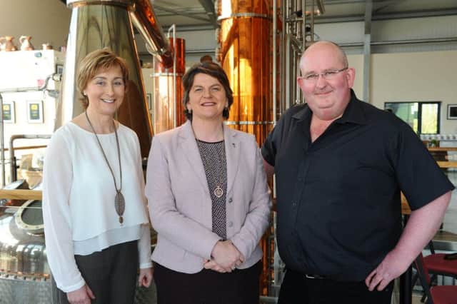First Minister Arlene Foster pictured at Echlinville Distillery with proprietors Shane and Lynn Braniff